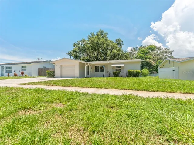 a house with garden in front of it