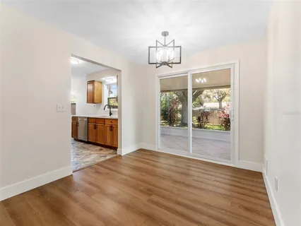 a view of livingroom and kitchen with wooden floor