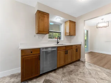 a spacious bathroom with a double vanity sink and mirror