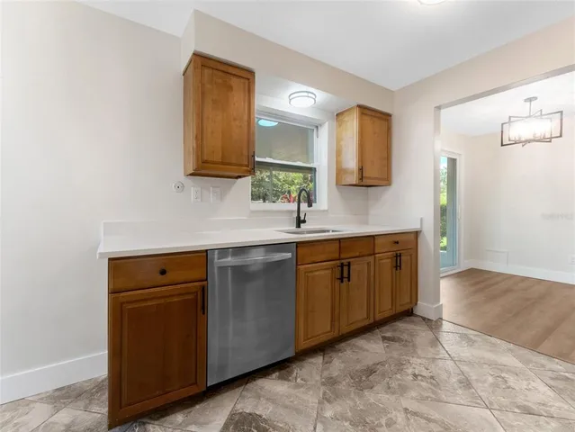 a spacious bathroom with a double vanity sink and mirror
