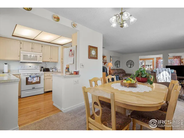 a view of kitchen with cabinets and wooden floor