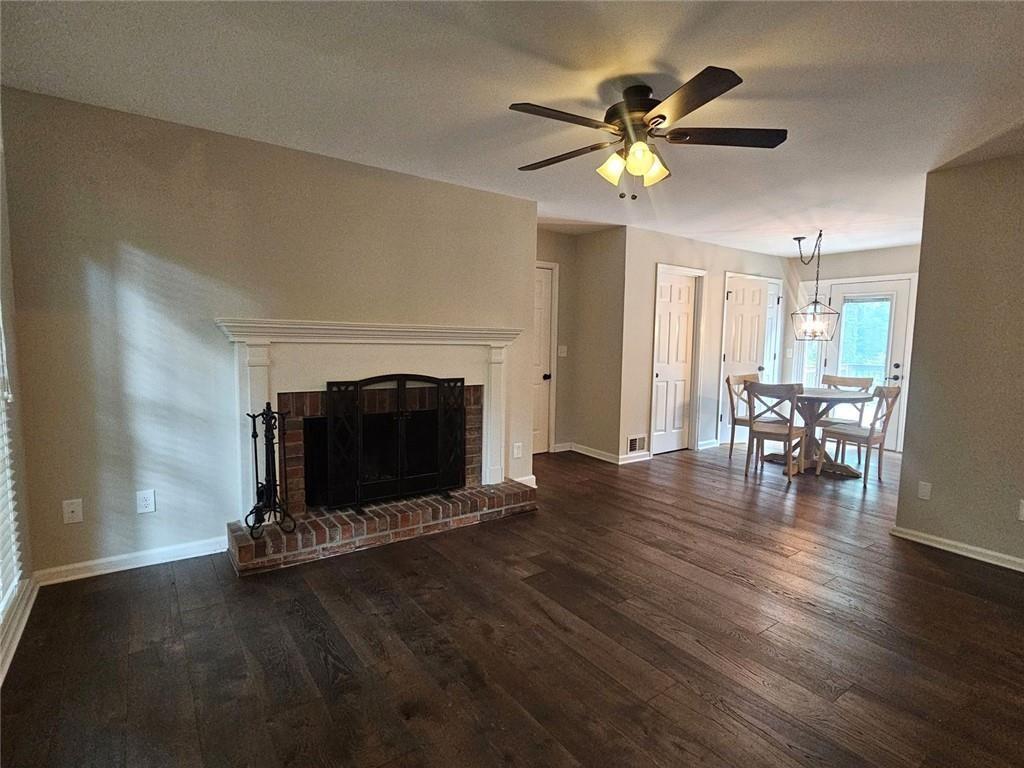 290 Oakmere Road Alpharetta, GA 30009 - Photo 3 of 26 a living room with furniture and a fireplace