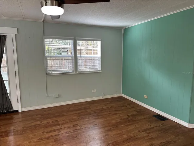 a view of closet with wooden floor
