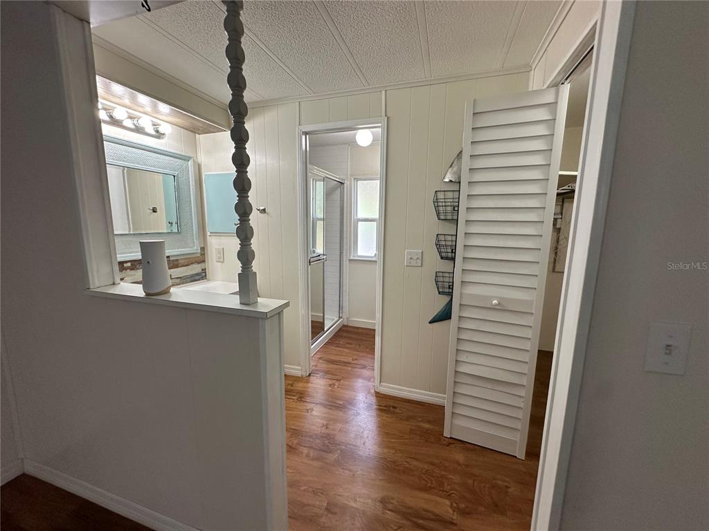 24007 River Road Astor, FL 32102 - Photo 20 of 37 a view of a hallway with wooden floor windows and livingroom