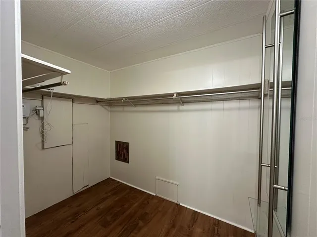 a view of backyard with a deck and wooden floor