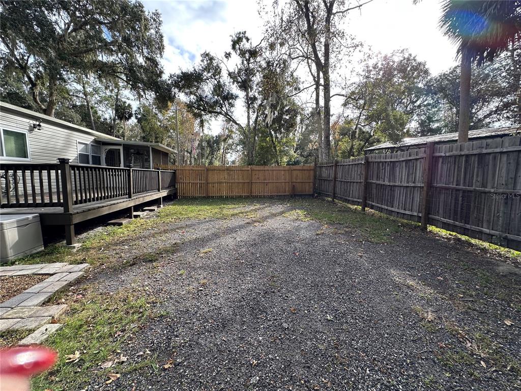 24007 River Road Astor, FL 32102 - Photo 35 of 37 a view of a backyard with wooden fence