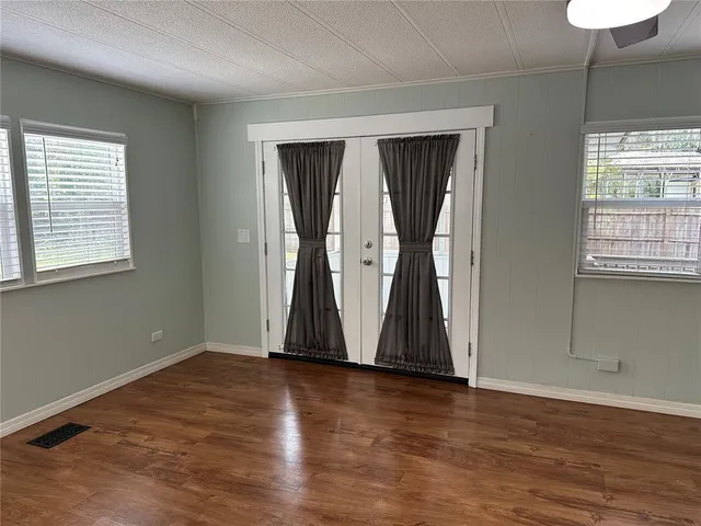 a view of living room with granite countertop furniture and flat screen tv