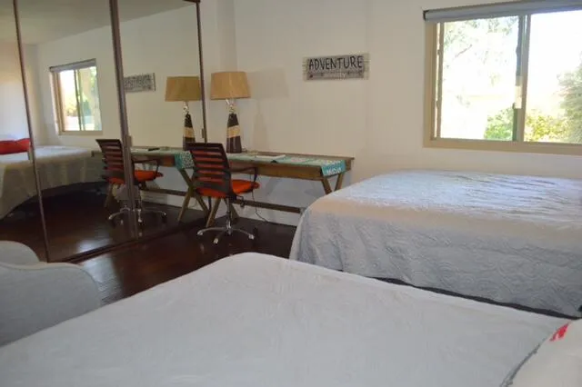 a living room with furniture a window and a table