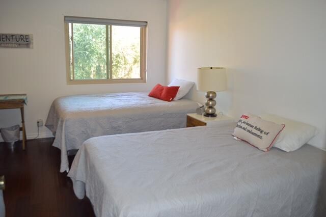 a bedroom with bed and window