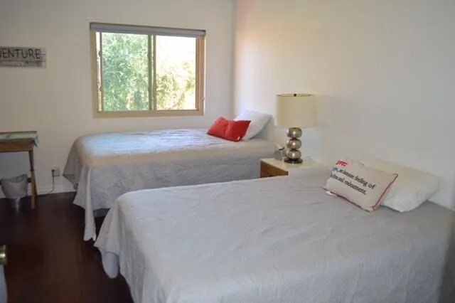 a bedroom with bed and window