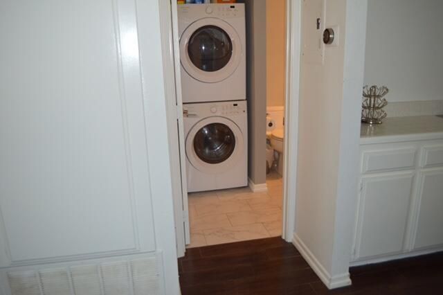 a view of a hallway with washer and dryer