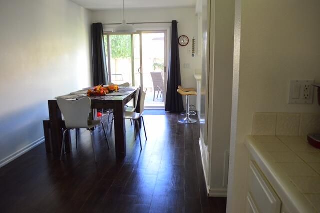 a view of a dining room with furniture window and wooden floor