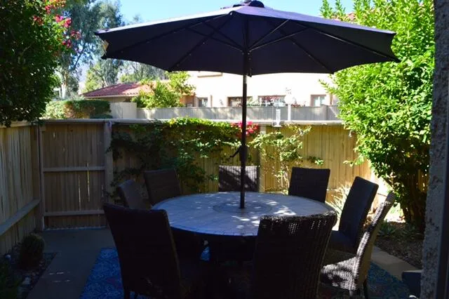 a view of balcony with furniture and outdoor seating