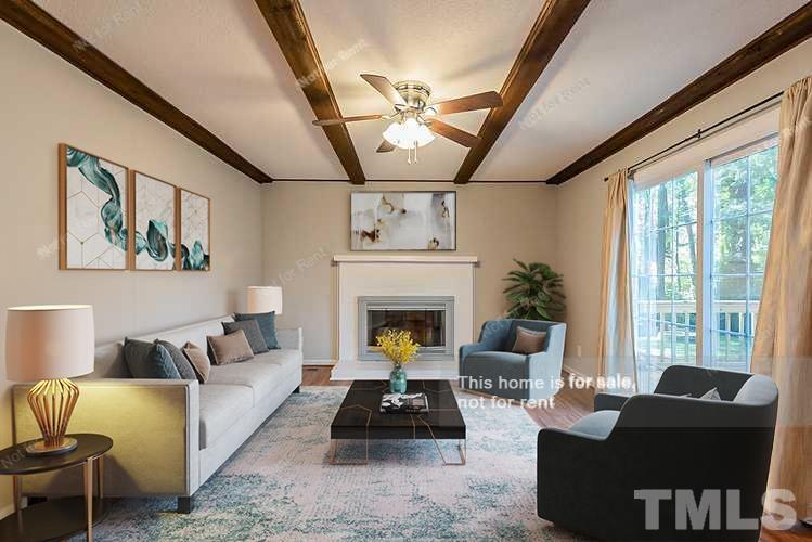 1338 Sedwick Road Durham, NC 27713 - Photo 2 of 20 a living room with furniture and a fireplace