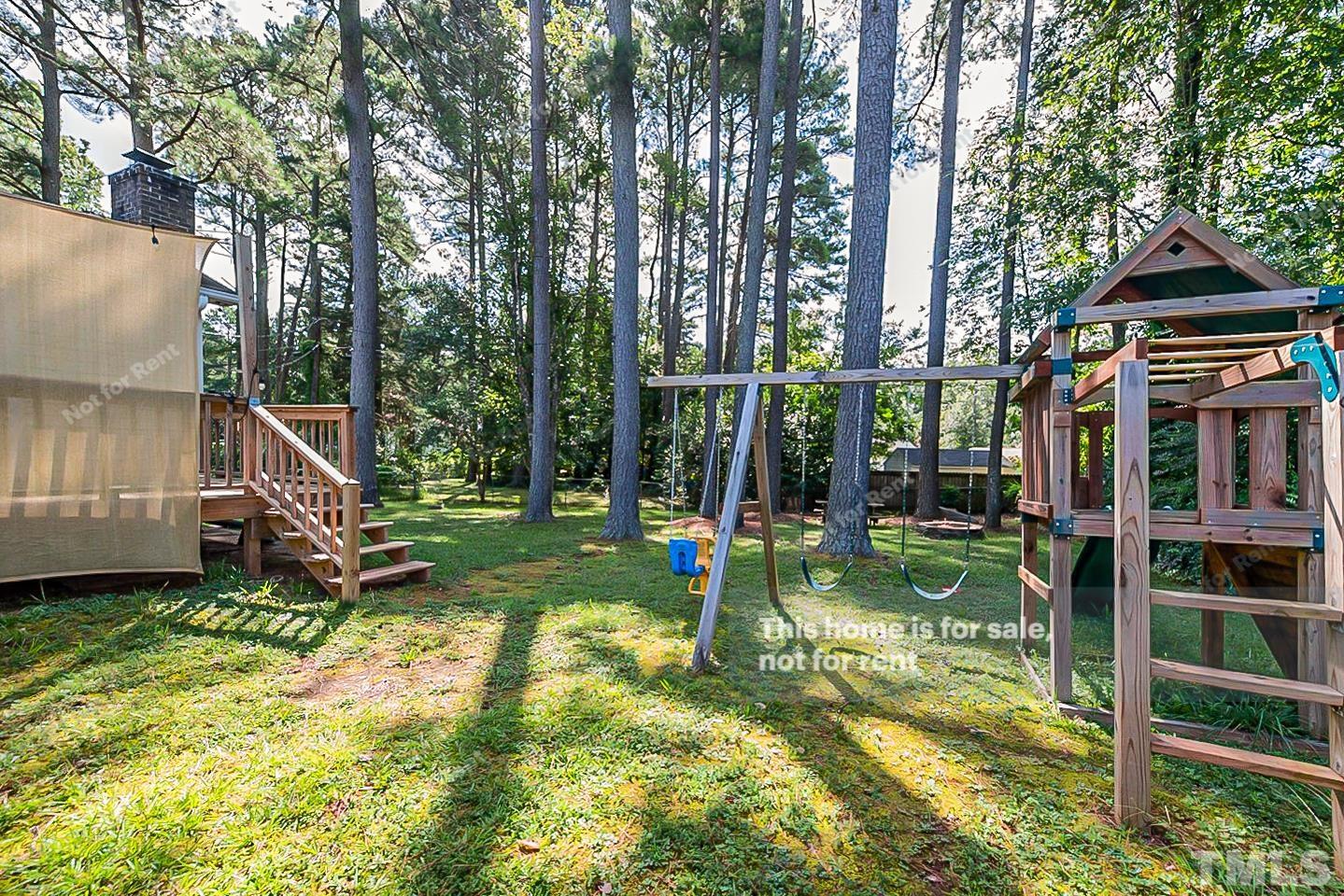 1338 Sedwick Road Durham, NC 27713 - Photo 19 of 20 a view of an house with backyard and swimming pool