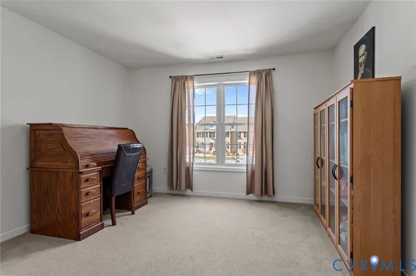 a spacious bathroom with a granite countertop sink a mirror a vanity and a