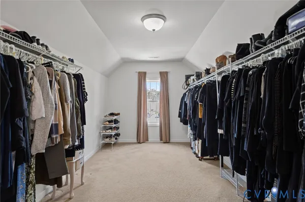 a bedroom with a bed and a lamp