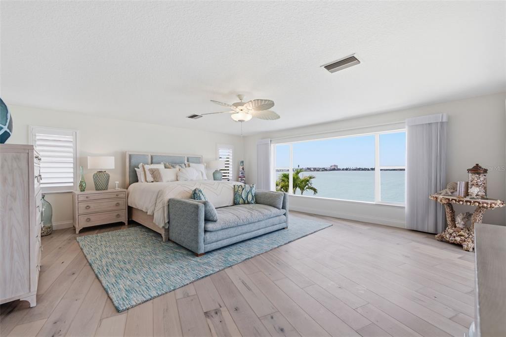 16123 6th Street East Redington Beach, FL 33708 - Photo 15 of 48 a spacious bedroom with a bed couch and a window