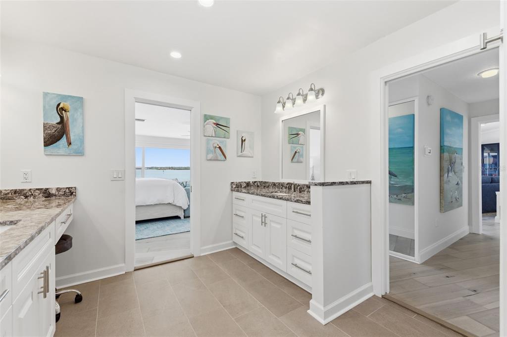 16123 6th Street East Redington Beach, FL 33708 - Photo 18 of 48 a utility room with cabinets and washer