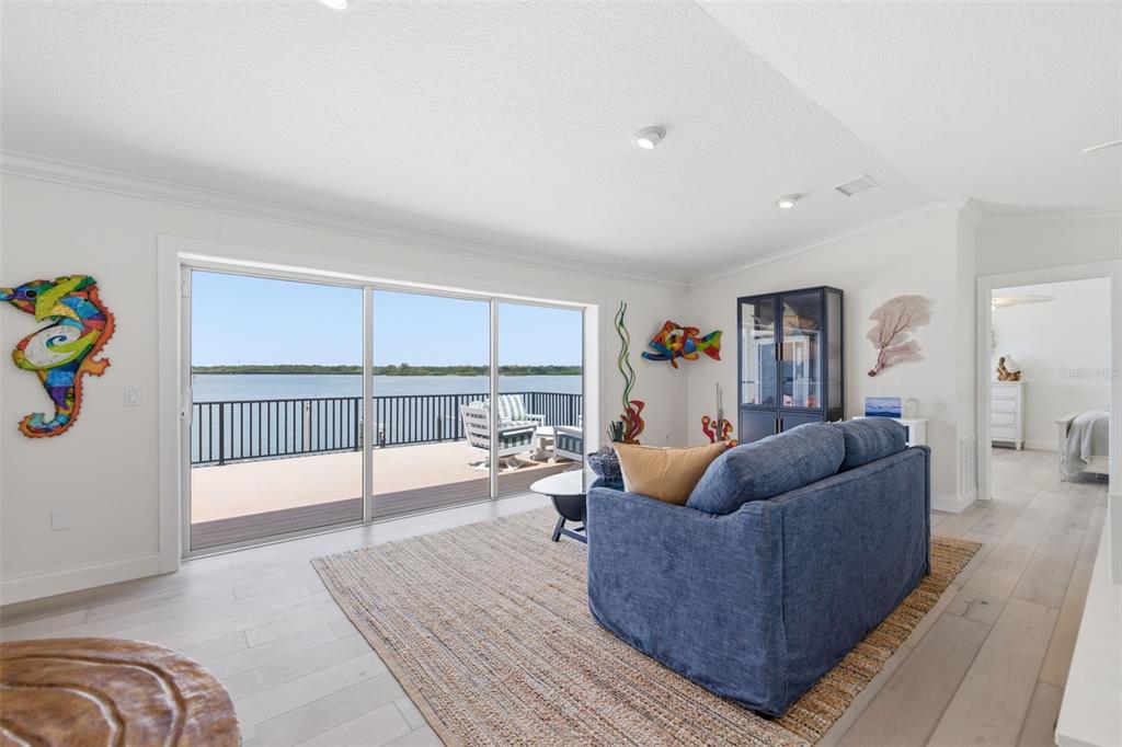 16123 6th Street East Redington Beach, FL 33708 - Photo 19 of 48 a living room with furniture and a table