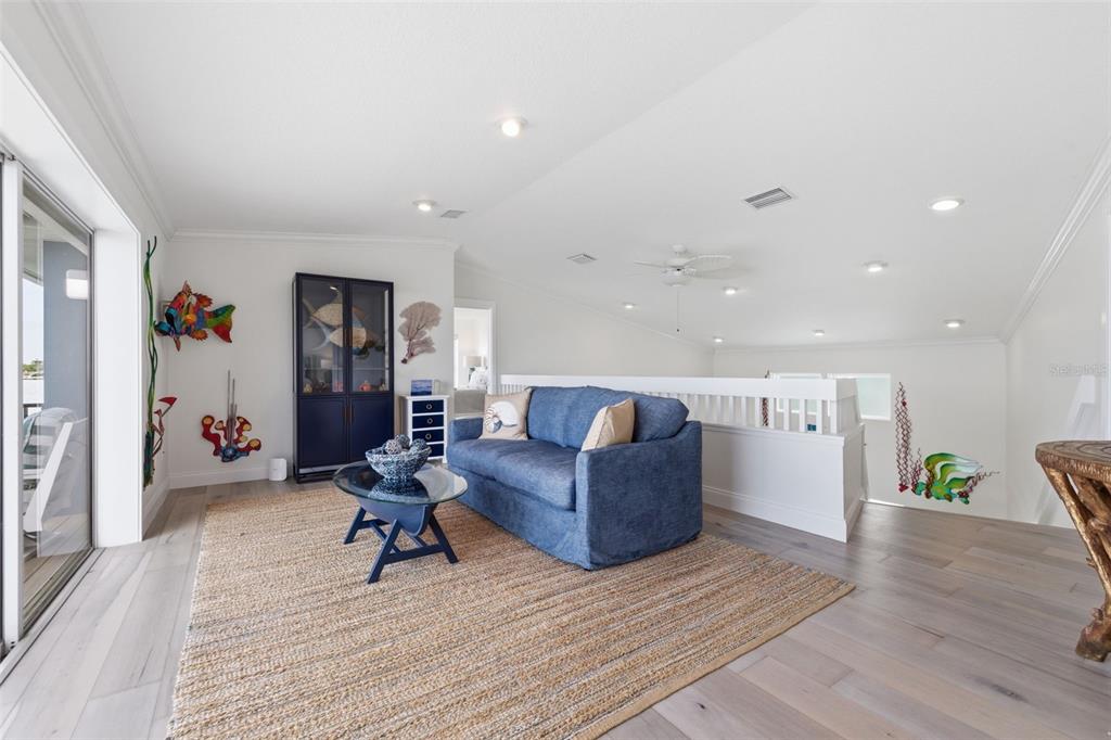 16123 6th Street East Redington Beach, FL 33708 - Photo 20 of 48 a living room with furniture and wooden floor