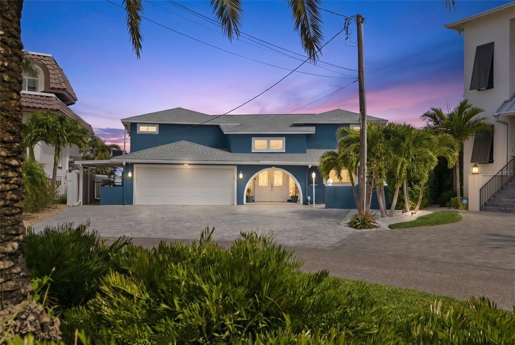 16123 6th Street East Redington Beach, FL 33708 - Photo 2 of 48 a front view of a house with a yard