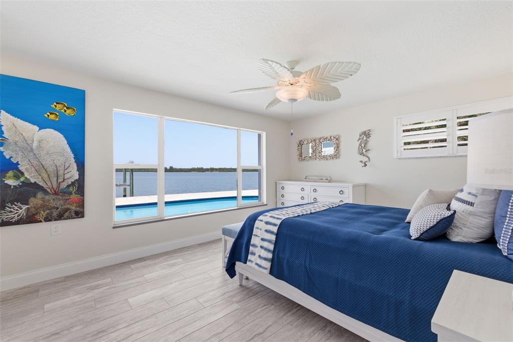 16123 6th Street East Redington Beach, FL 33708 - Photo 25 of 48 a bedroom with a large bed and a window