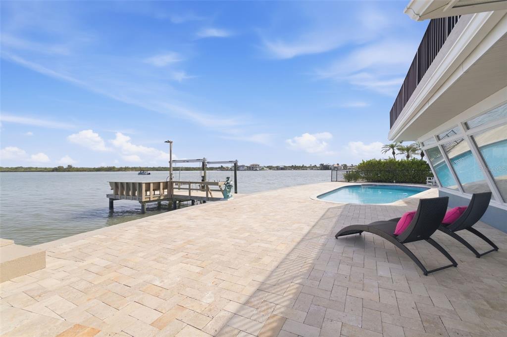 16123 6th Street East Redington Beach, FL 33708 - Photo 32 of 48 a swimming pool with outdoor seating and yard