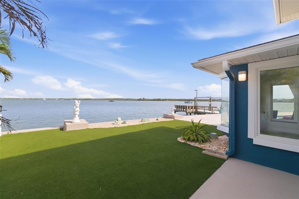 16123 6th Street East Redington Beach, FL 33708 - Photo 38 of 48 a backyard of a house with table and chairs
