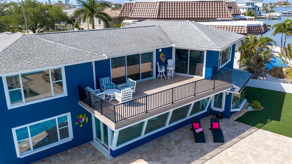 16123 6th Street East Redington Beach, FL 33708 - Photo 45 of 48 a front view of house with deck and outdoor seating