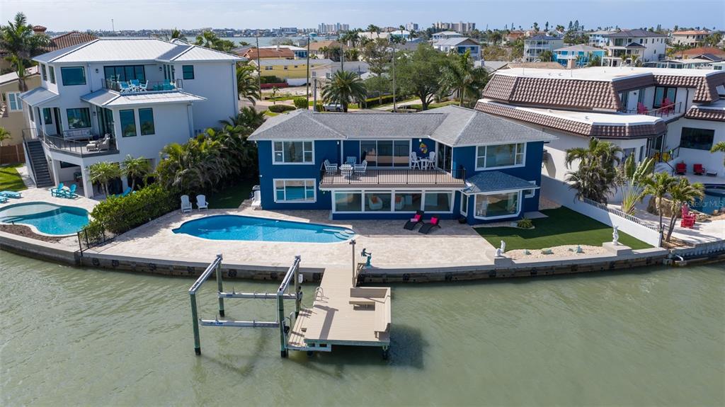 16123 6th Street East Redington Beach, FL 33708 - Photo 47 of 48 a aerial view of a house with swimming pool and a yard