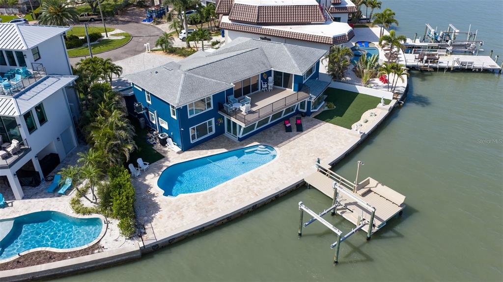 16123 6th Street East Redington Beach, FL 33708 - Photo 48 of 48 an aerial view of a house with a swimming pool patio and outdoor seating