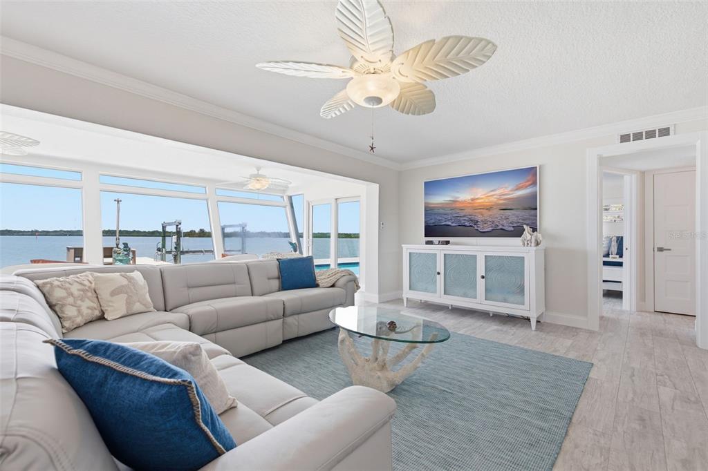 16123 6th Street East Redington Beach, FL 33708 - Photo 6 of 48 a living room with furniture and a flat screen tv