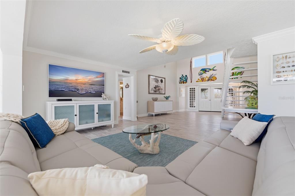 16123 6th Street East Redington Beach, FL 33708 - Photo 7 of 48 a living room with furniture fireplace and a flat screen tv