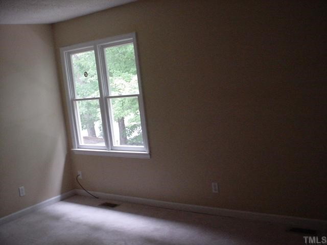645 Bashford Road Raleigh, NC 27606 - Photo 3 of 8 an empty room with a window