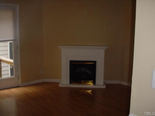645 Bashford Road Raleigh, NC 27606 - Photo 5 of 8 a view of empty room with a fireplace