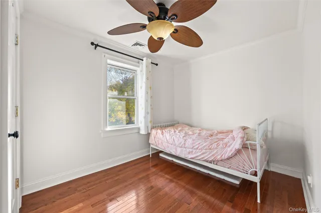 a bed room with a bed and a window