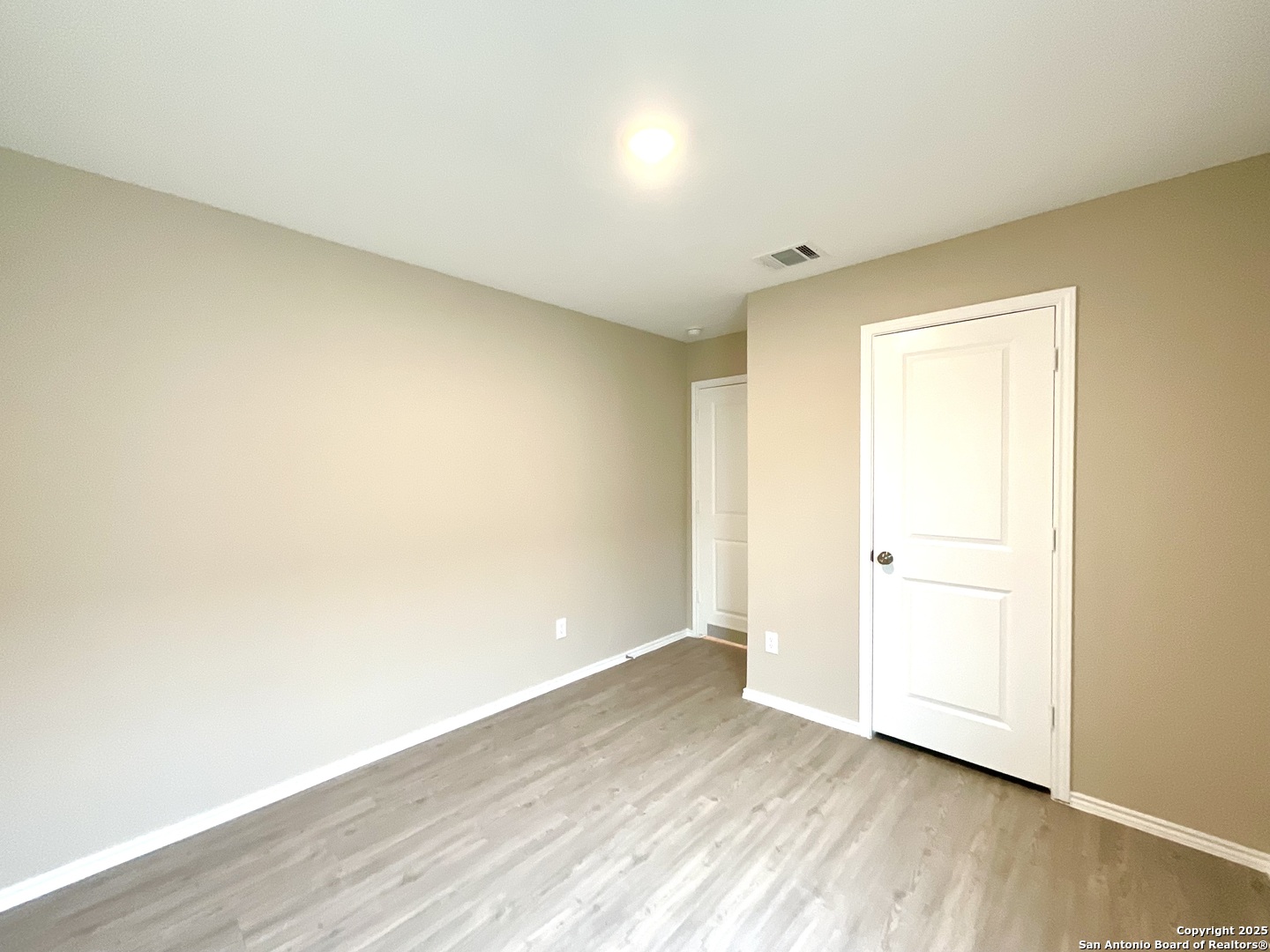 10751 Margarita Loop Converse, TX 78109 - Photo 15 of 40 an empty room with wooden floor
