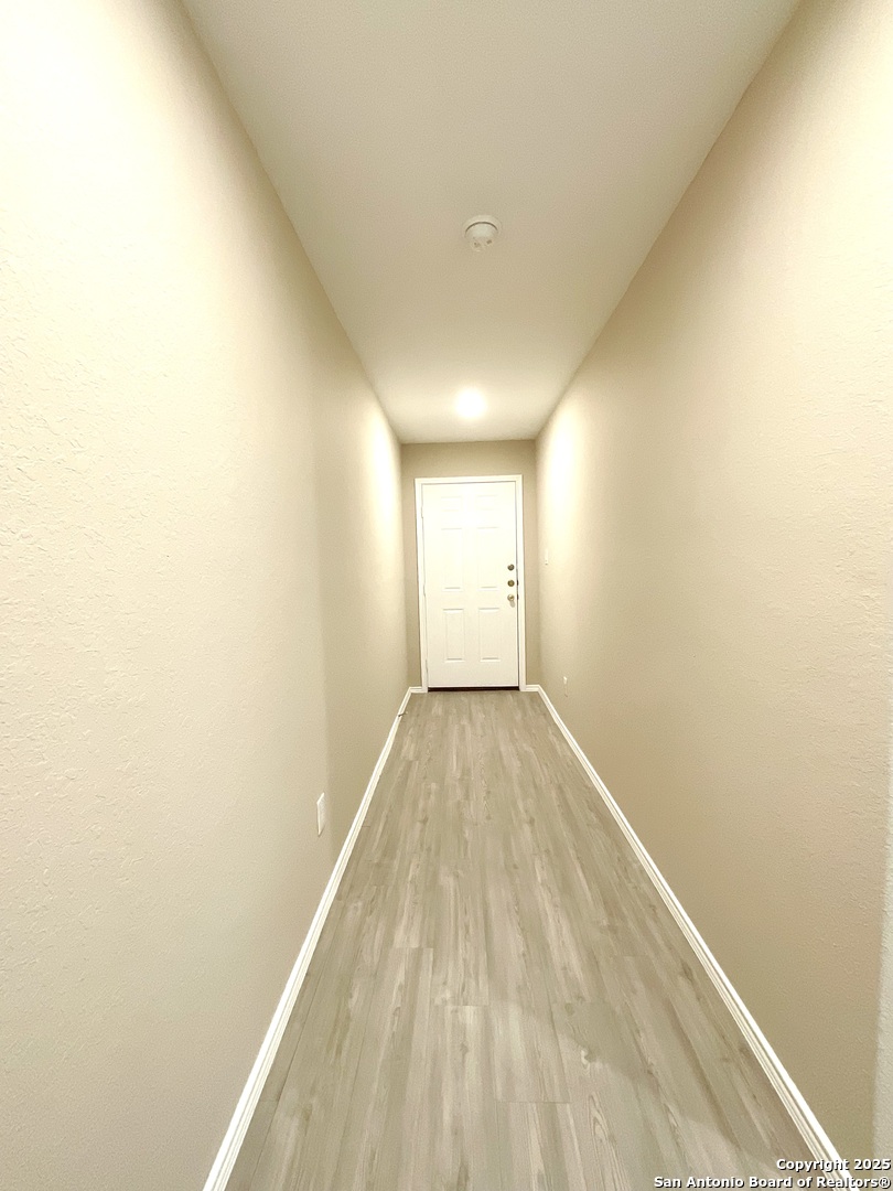 10751 Margarita Loop Converse, TX 78109 - Photo 2 of 40 a view of empty room with wooden floor