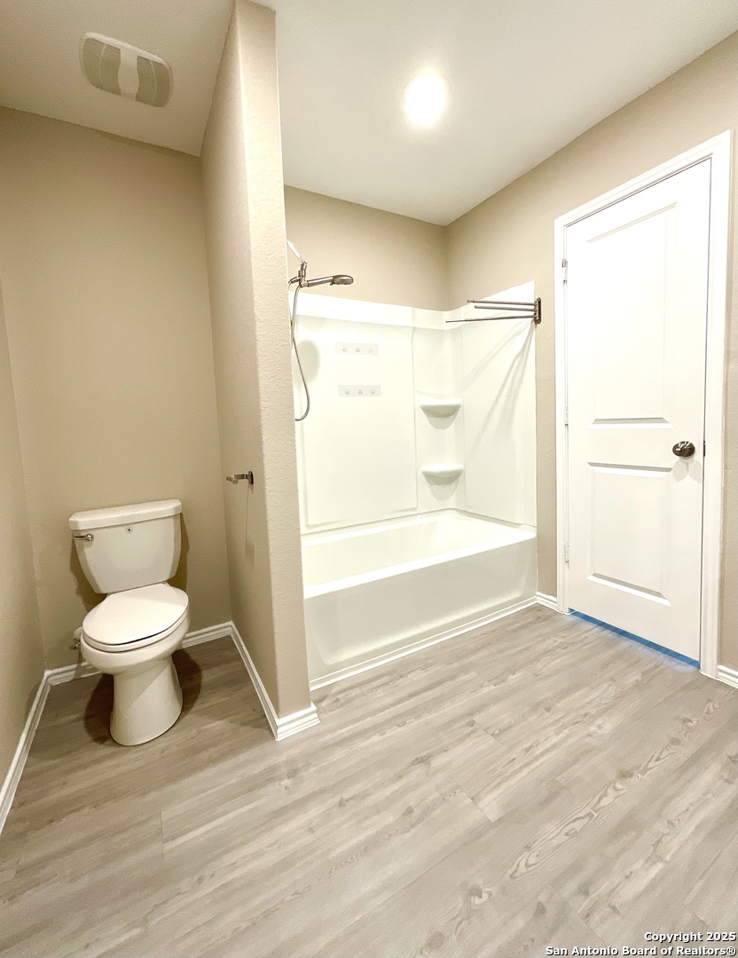 10751 Margarita Loop Converse, TX 78109 - Photo 29 of 40 a bathroom with a toilet and a shower