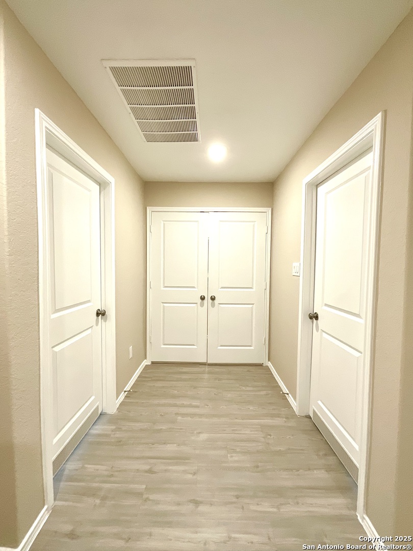 10751 Margarita Loop Converse, TX 78109 - Photo 4 of 40 a view of a livingroom with wooden floor and a refrigerator