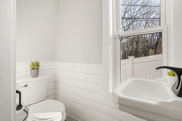 a bathroom with a toilet and a sink