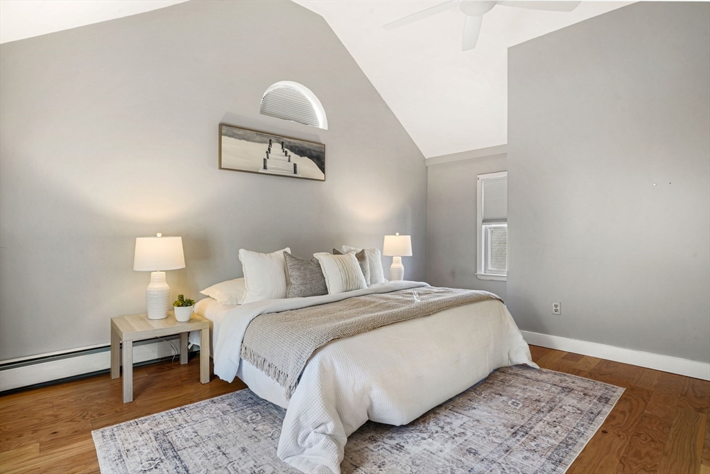 12 Sassamon Street Canton, MA 02021 - Photo 16 of 38 a bed room with a bed and a painting on the wall