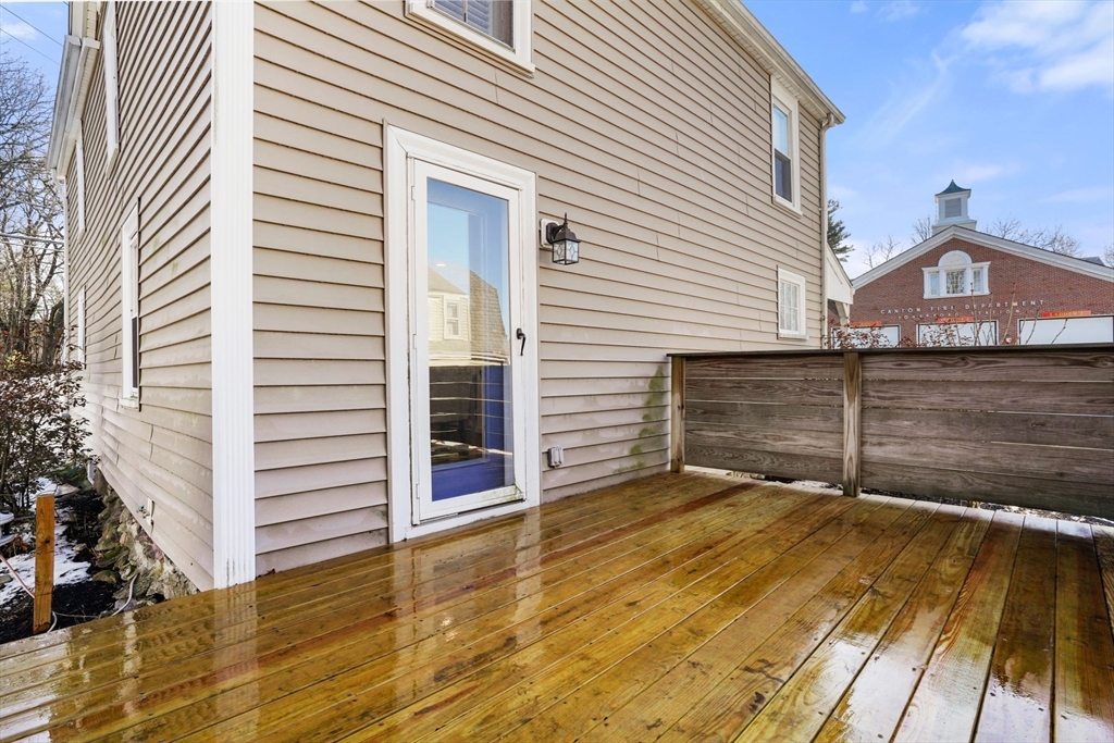 12 Sassamon Street Canton, MA 02021 - Photo 26 of 38 a view of a house with a wooden deck