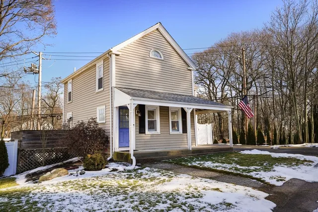 a front view of a house with a yard
