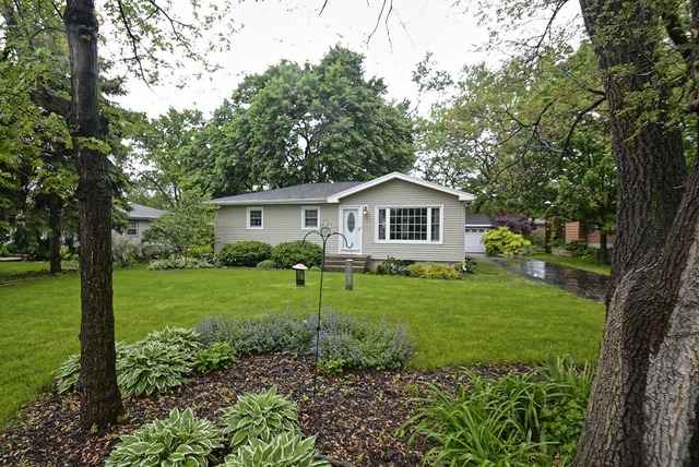 318 Village Road Willowbrook, IL 60527 - Photo 1 of 23 a view of a house with backyard and garden