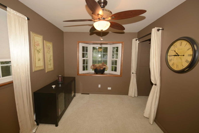 318 Village Road Willowbrook, IL 60527 - Photo 14 of 23 a living room with furniture and a window
