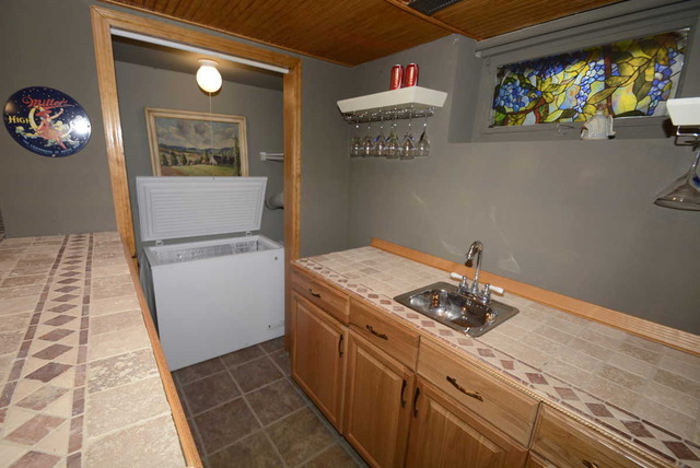 318 Village Road Willowbrook, IL 60527 - Photo 21 of 23 a kitchen with a stove and a white wooden floor