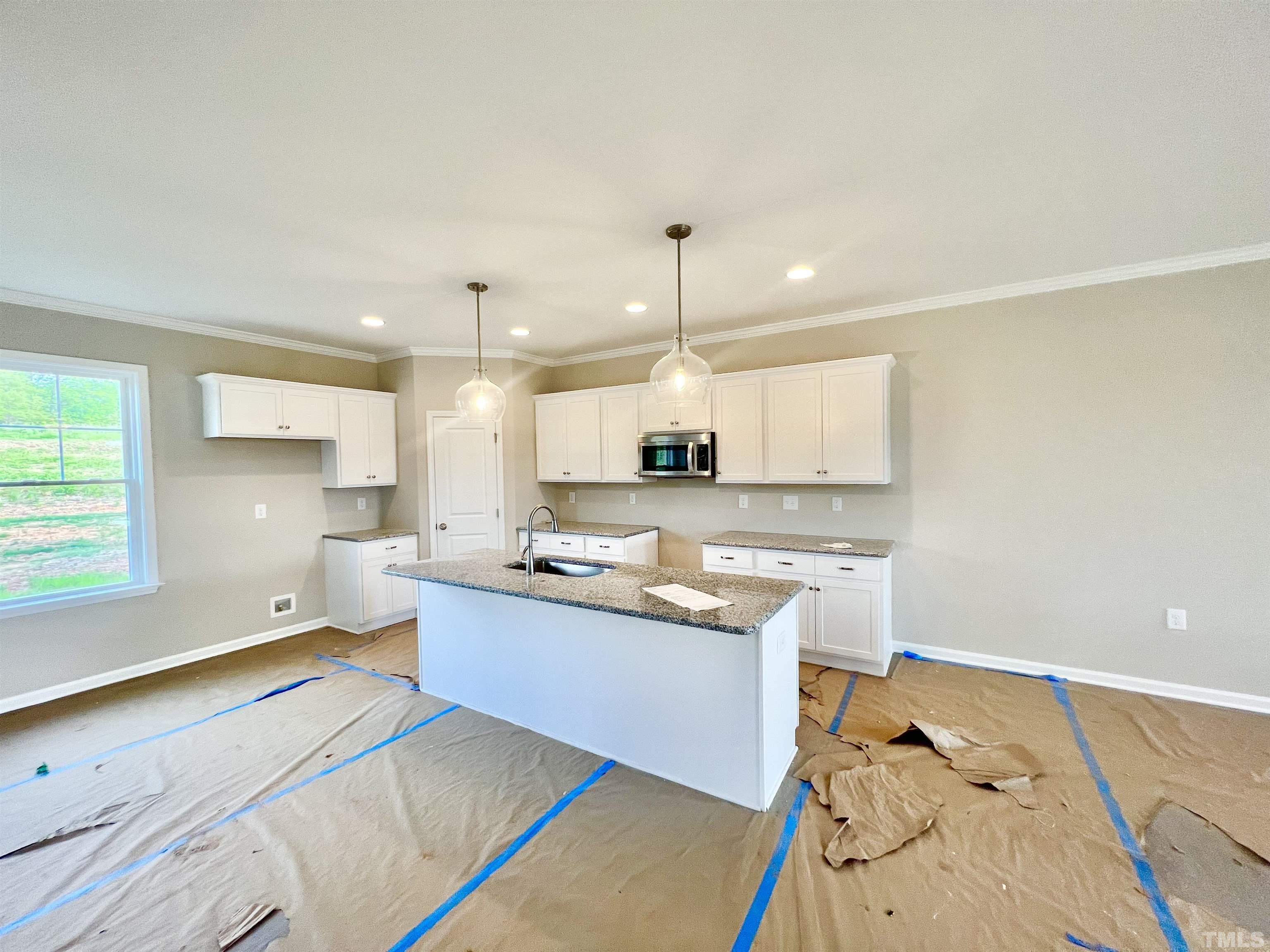 4525 Debnam Road Zebulon, NC 27597 - Photo 3 of 10 a large kitchen with a counter space