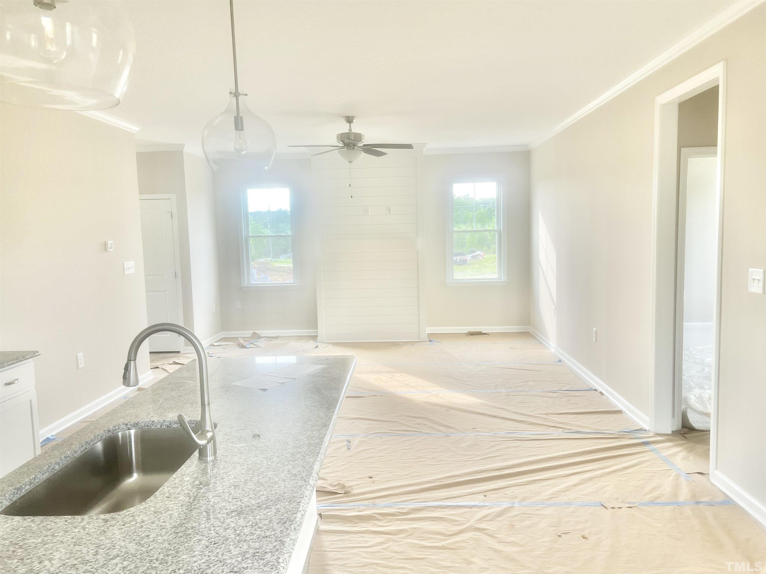 4525 Debnam Road Zebulon, NC 27597 - Photo 5 of 10 a bathroom with a granite countertop sink a toilet and mirror